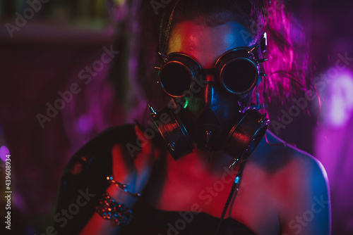 Portrait of a cyberpunk girl in a gas mask and glasses in the style of the post-apocalypse. Steampunk style