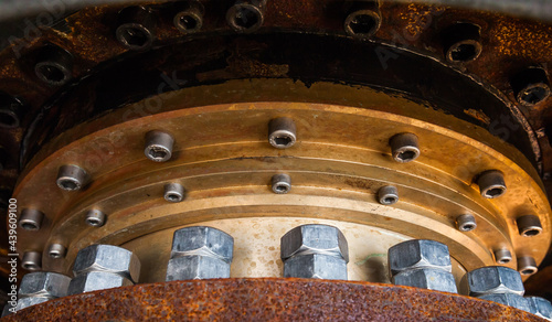 Large bolted connection. Basis for attaching an azimuth thruster on a ship. Bolts and nuts are screwed to the body.