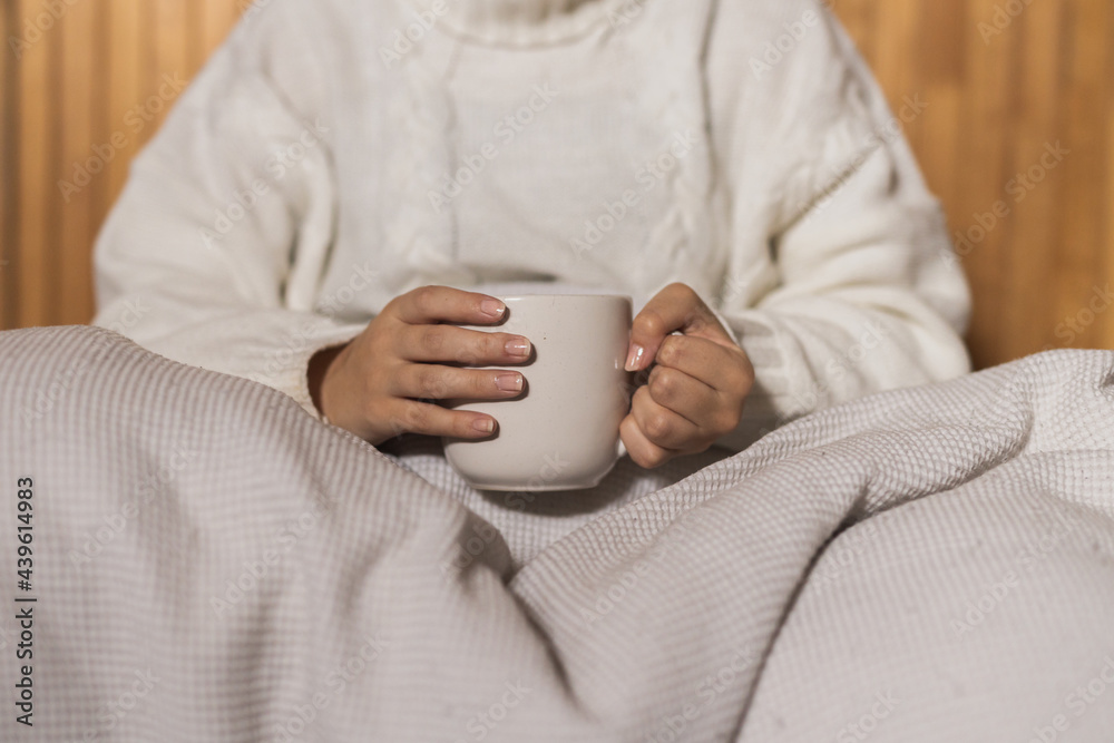 Person holding hot drink coffee 