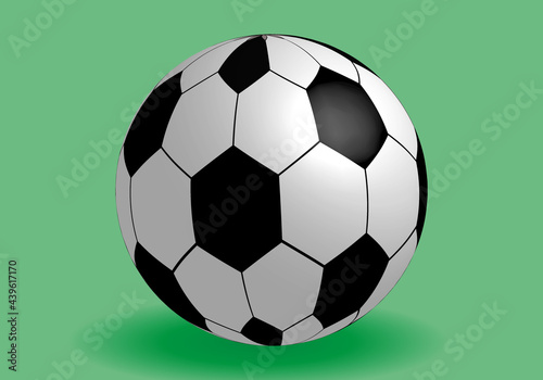 Balón de fútbol sobre fondo verde.