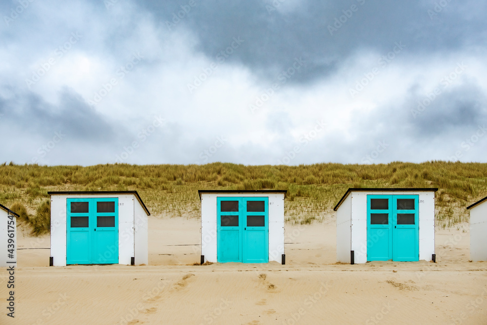 Beachhouses in the dunes at the beach on Texel island in the Netherlands. Beachhouses in the dunes at the beach on Texel island in the Netherlands.