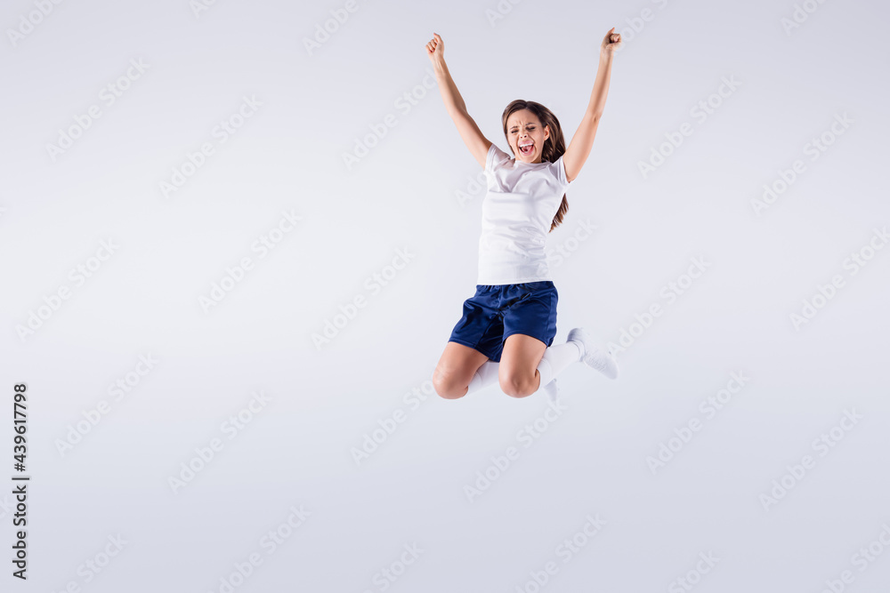 Full length body size view of nice attractive lovely crazy energetic overjoyed cheerful cheery straight-haired girl jumping having fun rejoicing isolated on light white gray pastel color background Full length body size view of nice attractive lovely crazy energetic overjoyed cheerful cheery straight-haired girl jumping having fun rejoicing isolated on light white gray pastel color background