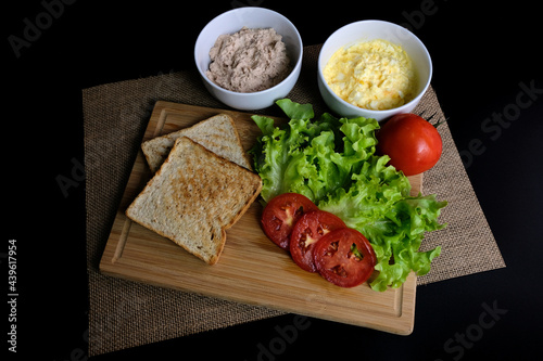 Tuna Sandwich with Vegetables on black background.  Suitable for breakfast.