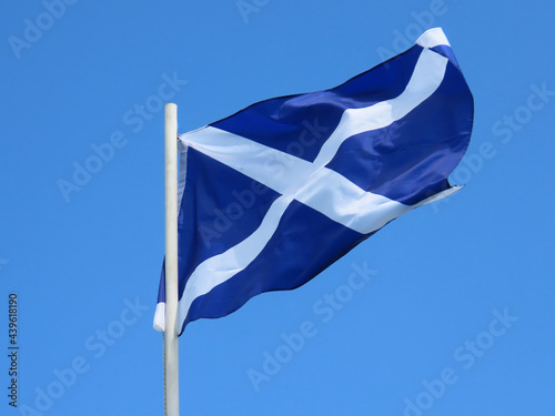 Obraz na plátne Scotland flag - white saltire on blue field - bold and proud floating in the win