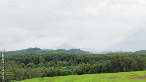 Wallpaper Mural Timelapse of dramatic spectacular lenticular cloud formation over mountain with trees in the foreground Torontodigital.ca