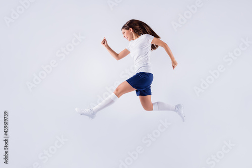 Full length body size view of nice attractive lovely slim crazy overjoyed cheerful cheery straight-haired girl jumping having fun running isolated on light white gray pastel color background
