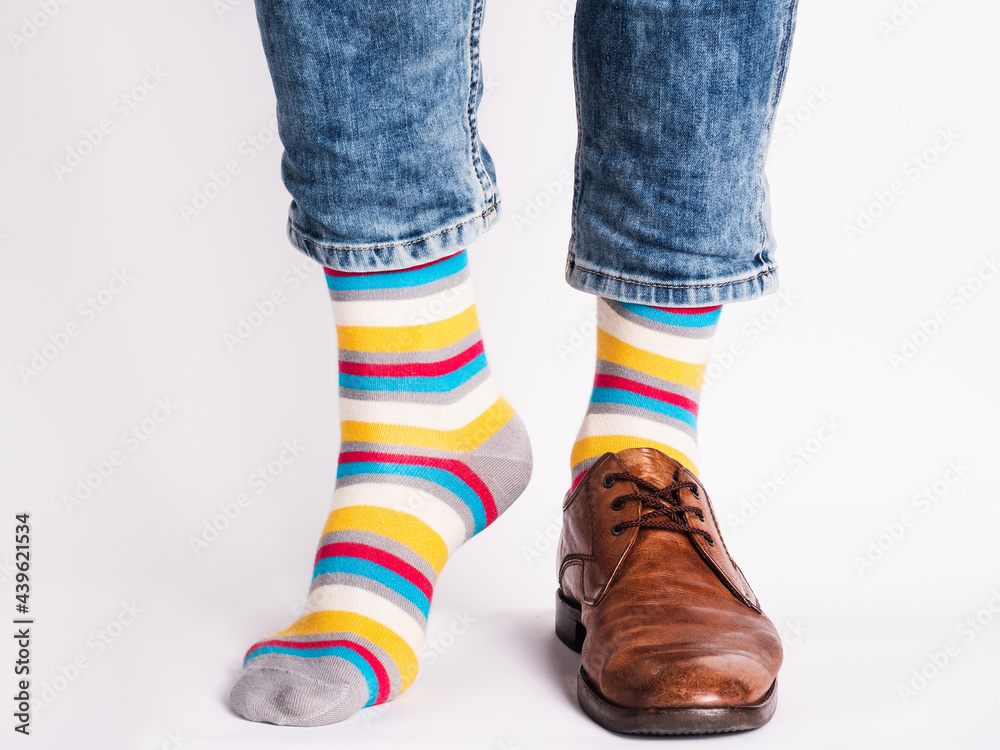 Men's legs, trendy shoes and bright socks. Close-up. Style, beauty and elegance concept Men's legs, trendy shoes and bright socks. Close-up. Style, beauty and elegance concept