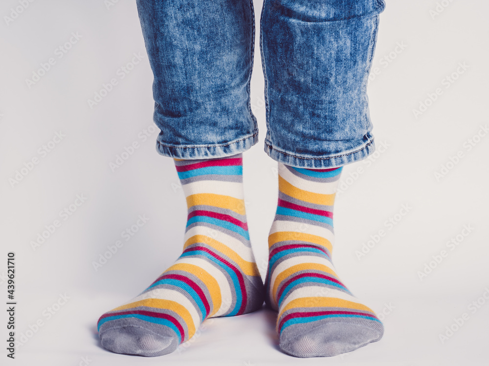 Men's legs and bright socks. Without shoes. Close-up. Style, beauty and elegance concept Men's legs and bright socks. Without shoes. Close-up. Style, beauty and elegance concept