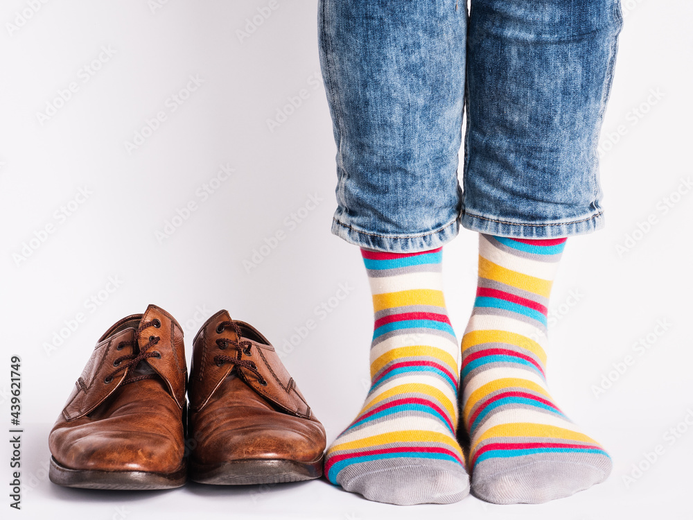 Men's legs, trendy shoes and bright socks. Close-up. Style, beauty and elegance concept