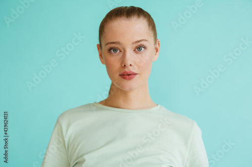 Young blonde white woman posing and looking at camera