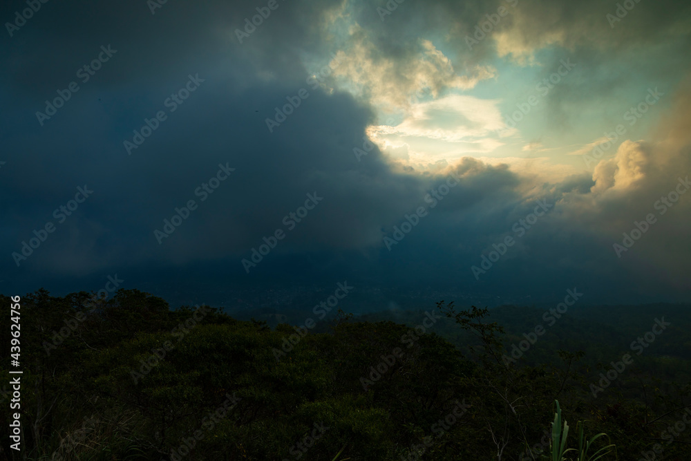 Landscape of storm and clouds at sunset over the slopes of Mount Mahawu, a stratovolcano located in North Tomohon, North Sulawesi, Indonesia