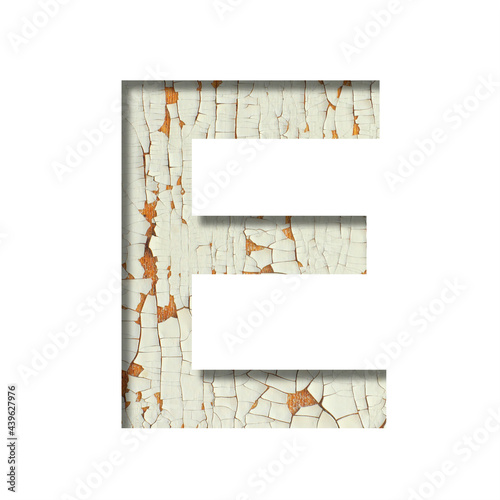 Rustic font. The letter E cut out of paper on the background of old rustic wall with peeling paint and cracks. Set of simple decorative fonts