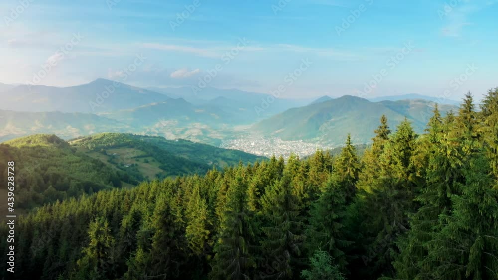 Flying above mountain resort, summer landscape in relaxing small mountain village in Romania