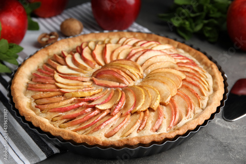 Delicious homemade apple tart on grey table