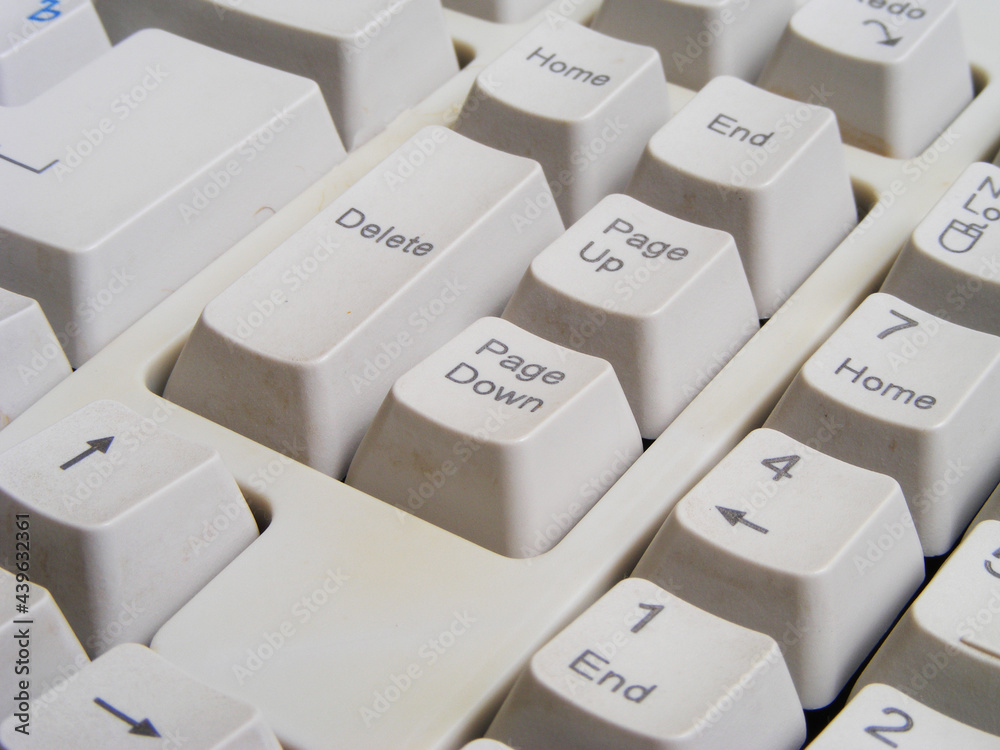 Close up of old computer keyboard white color
Close up of old computer keyboard white color