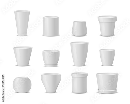 Set of realistic white ceramic flower pots.