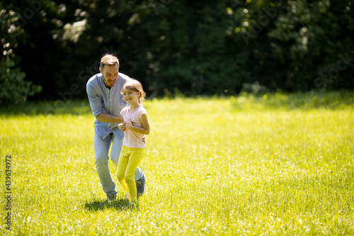 Father chasing his little d...