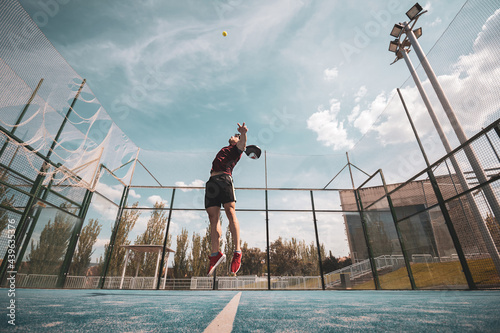 padel player playing a match in the open photo