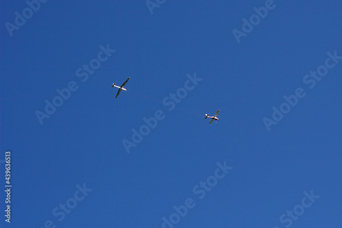 two light planes in the blue summer sky