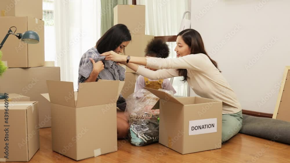 Happy asian women LGBT lesbian couple holding boxes entering new modern house.family unpacking boxes. Happy asian women LGBT lesbian couple holding boxes entering new modern house.family unpacking boxes.