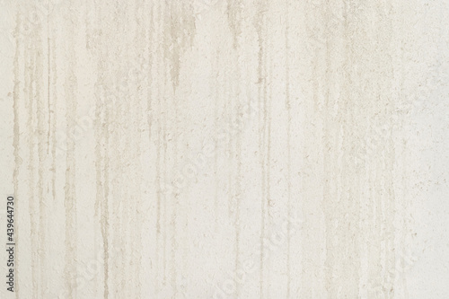Abstract texture of a white concrete wall with gray smudges and dirt, background