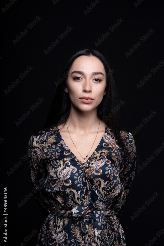 portrait of a young woman in the studio on a dark background portrait of a young woman in the studio on a dark background