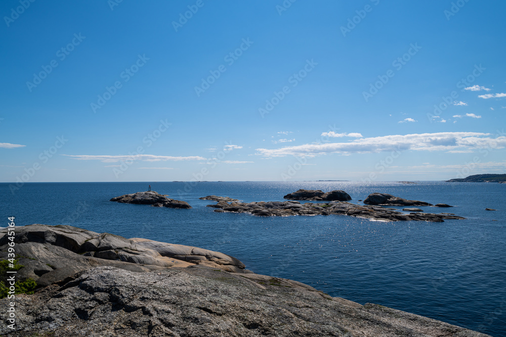 the beautiful coast of norway with its rock formations and blue water on a beautiful summer day the beautiful coast of norway with its rock formations and blue water on a beautiful summer day