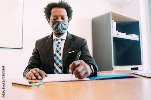 Businessman working with some files at office.