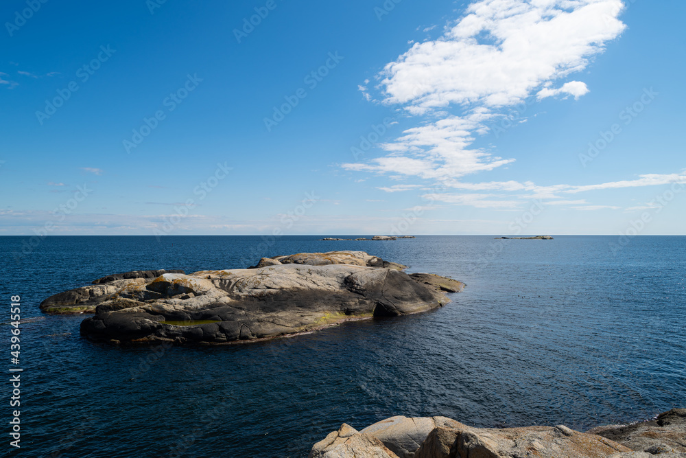 the beautiful coast of norway with its rock formations and blue water on a beautiful summer day