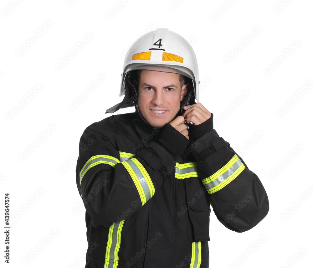 Portrait of firefighter in uniform wearing helmet on white background