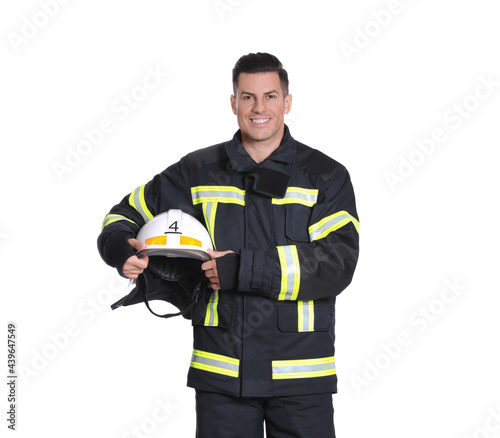 Foto Portrait of firefighter in uniform with helmet on white background