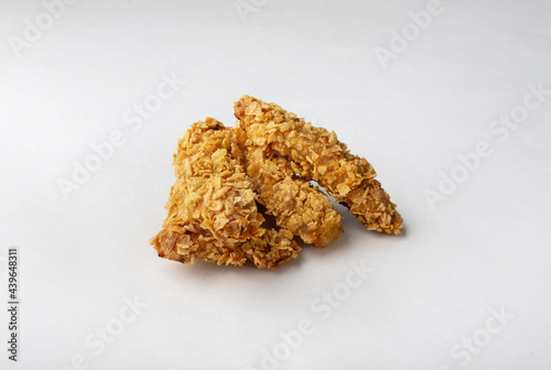 Chicken strips on a white background. Chicken strips baked in cornflakes. Proper nutrition.
