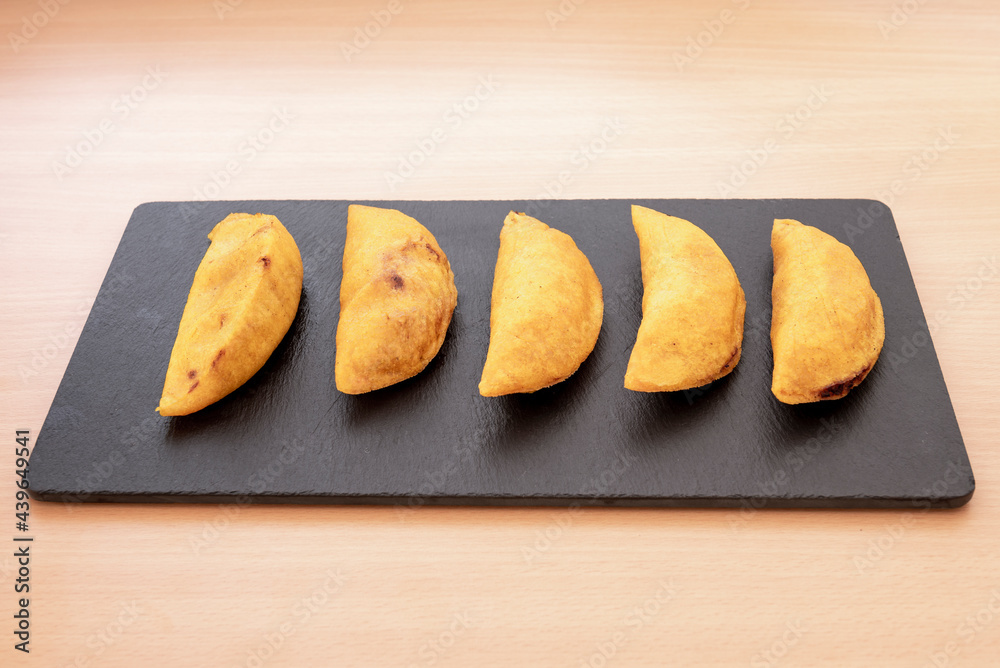 Colombian corn flour dumplings stuffed with meat fried in Spanish olive oil served Colombian corn flour dumplings stuffed with meat fried in Spanish olive oil served