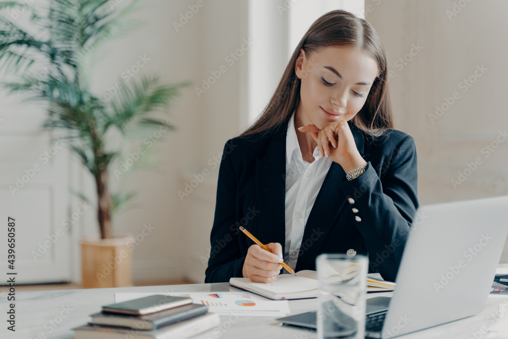 Concentrated business woman thinking about work issues at office Concentrated business woman thinking about work issues at office