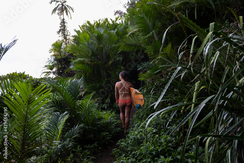 Female Surfer in Costa Rica looking at waves  photo