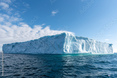 Massive iceberg in rippling cold sea
 photo