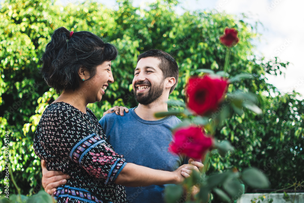 Adorable couple dancing in their garden Adorable couple dancing in their garden