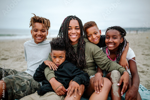 Mom and four kids at the beach photo