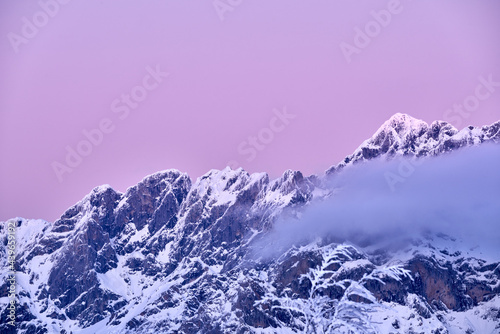Severe Landscape With Snowy Rocky Mountain Peak