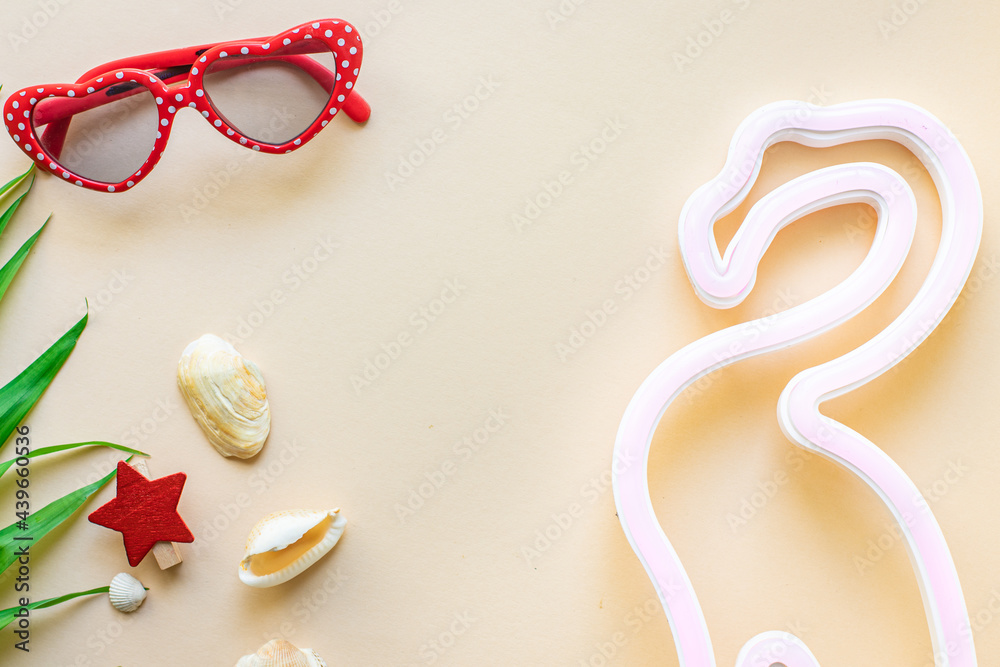 summer mood background tropical leaf, sunglasses, seashell, cocktail tubes travel accessories vacation summer relax mood top view