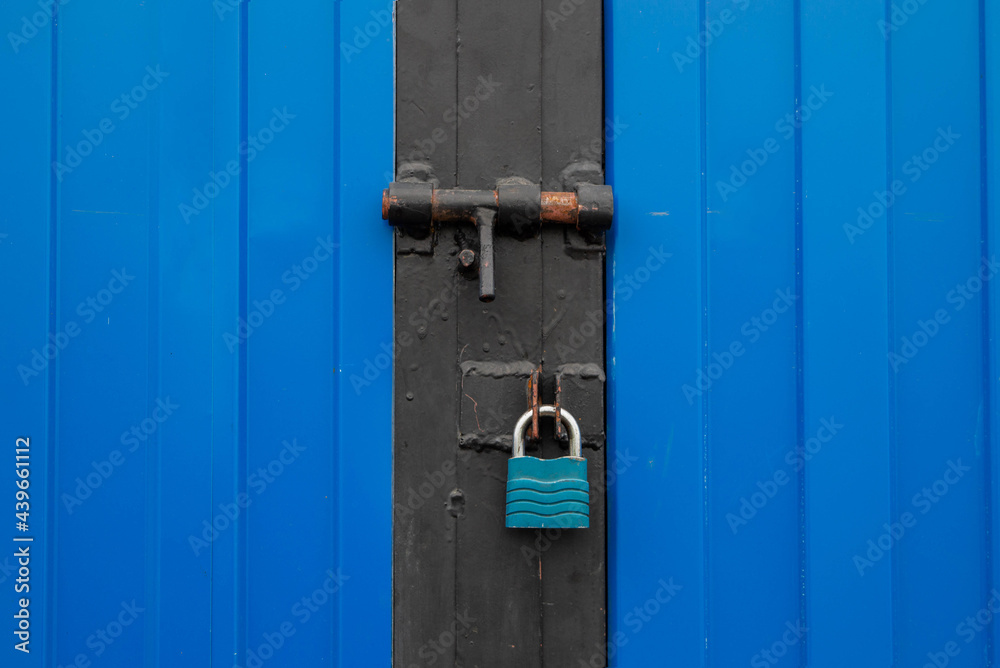 Blue garage door with two locks