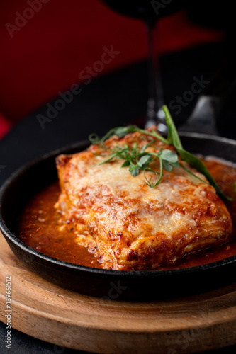 Beef lasagna and red wine, yammy elegant photo