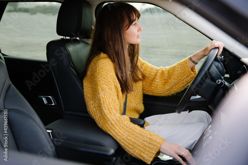 A woman driving a car photo