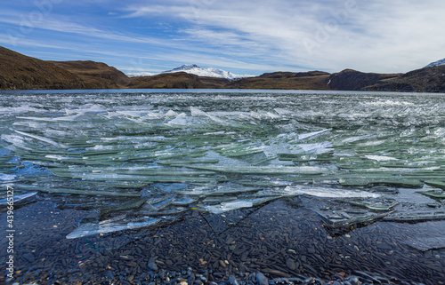 Winter in Patagonia: drift ice on a lake in the hills 