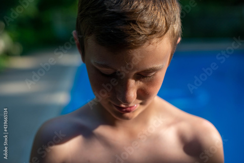 Teen Boy Portrait by a Pool photo