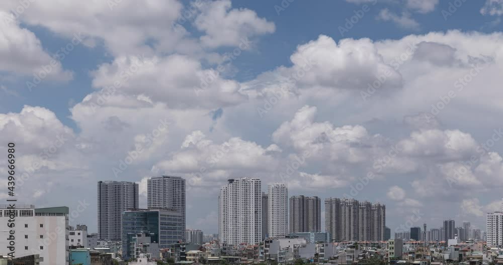 Urban time lapse featuring high rise apartment buildings, dramatic clouds and interesting moving shadows Urban time lapse featuring high rise apartment buildings, dramatic clouds and interesting moving shadows