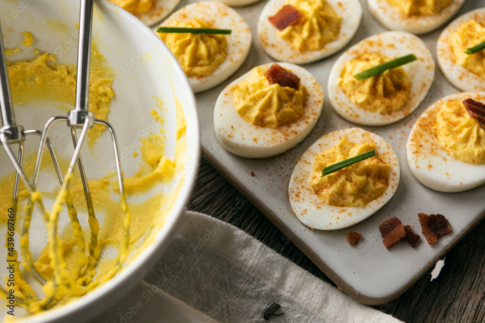 Tasty Deviled Eggs On Tray With Mixing Bowl Nearby Tasty Deviled Eggs On Tray With Mixing Bowl Nearby