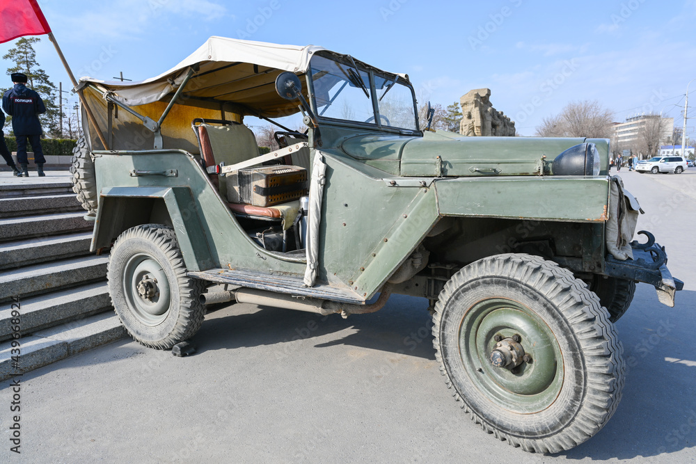 A military vehicle, an old military vehicle from the Second World War on a snow-covered city street. Soviet Two World War Four-wheel drive. A military vehicle, an old military vehicle from the Second World War on a snow-covered city street. Soviet Two World War Four-wheel drive.