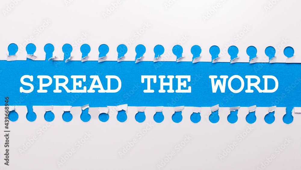 On a blue background with text SPREAD THE WORD two white torn strips of paper. On a blue background with text SPREAD THE WORD two white torn strips of paper.