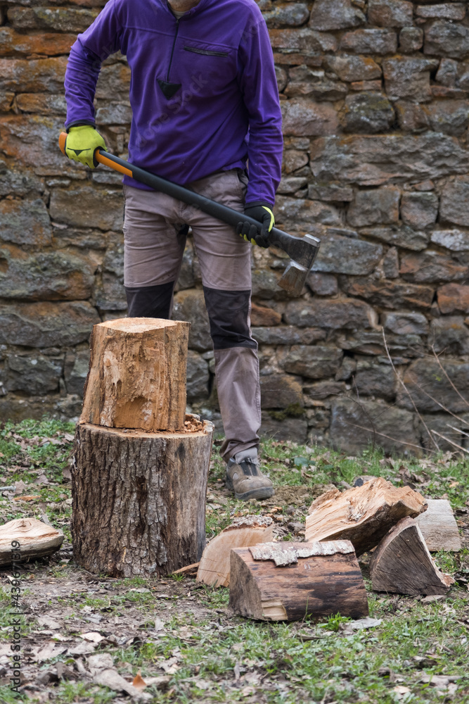man's body holding a wood chopping axe man's body holding a wood chopping axe